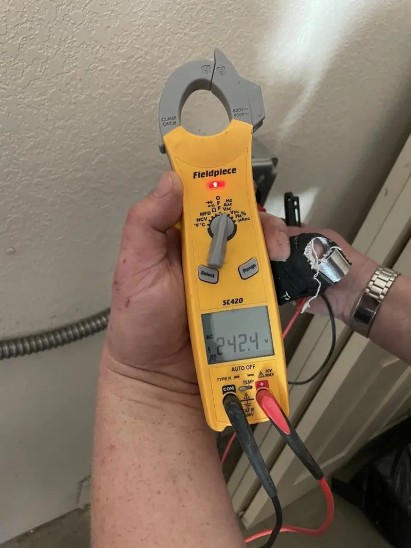 Voltage testing with clamp meter during Ceiling Fan Installation in Goodlettsville